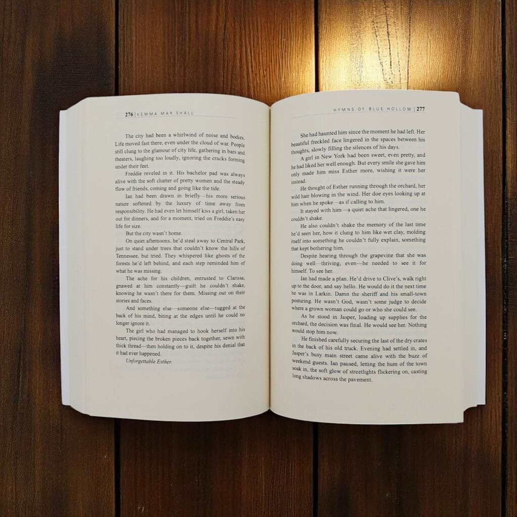 An open paperback book laid flat on a wooden table, pages spread with visible text in two columns on each page edge-to-edge.